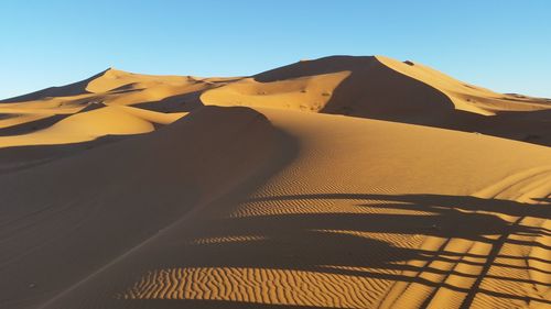 Scenic view of desert against clear sky