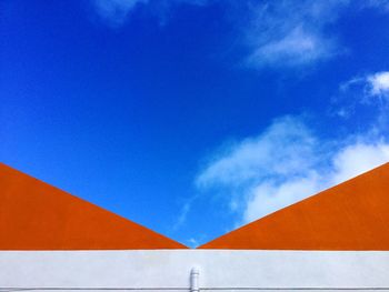 Close-up of built structure against blue sky