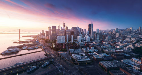 Cityscape against sky during sunset