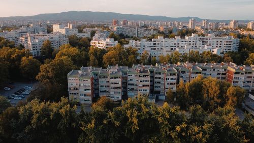 High angle view of trees and buildings against sky