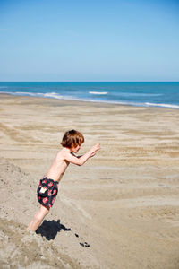 Full length of boy on beach
