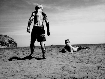 Full length of woman standing on beach