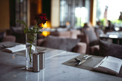 Close-up of flower vase on table