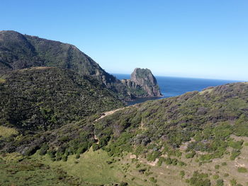 Scenic view of mountains against clear blue sky