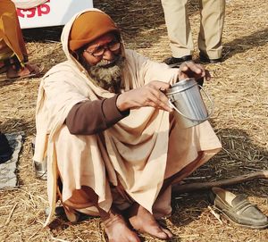 Rear view of people sitting outdoors