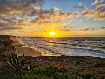 Scenic view of sea against sky during sunset