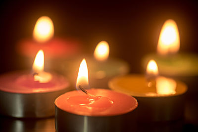 Close-up of illuminated tea light candles