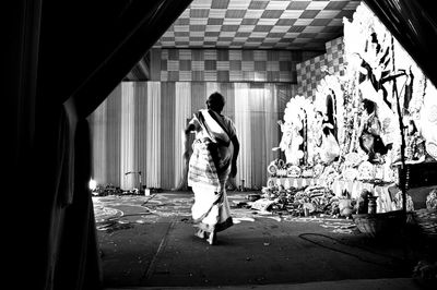 Rear view of man walking on street