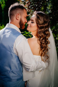 Midsection of couple holding hands