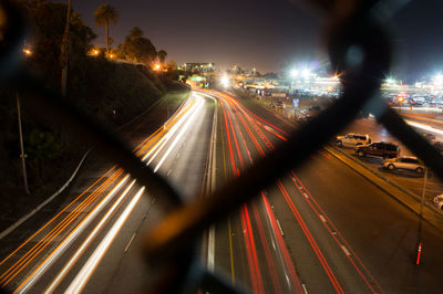 High angle view of light trails on road at night