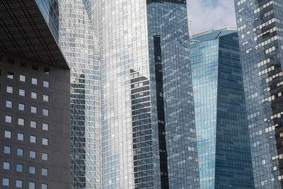 Low angle view of skyscrapers against sky