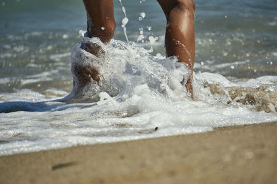 Low section of person on beach