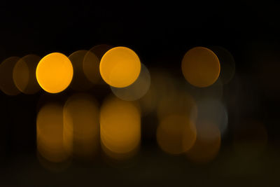 Defocused image of lights against black background