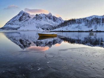 Scenic view of snowcapped mountains against sky during winter