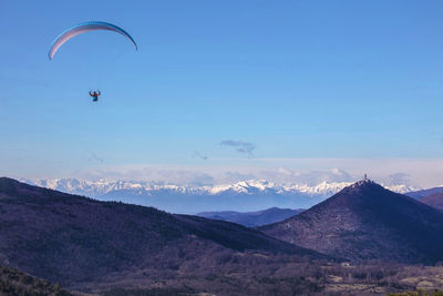 Scenic view of mountains against clear blue sky