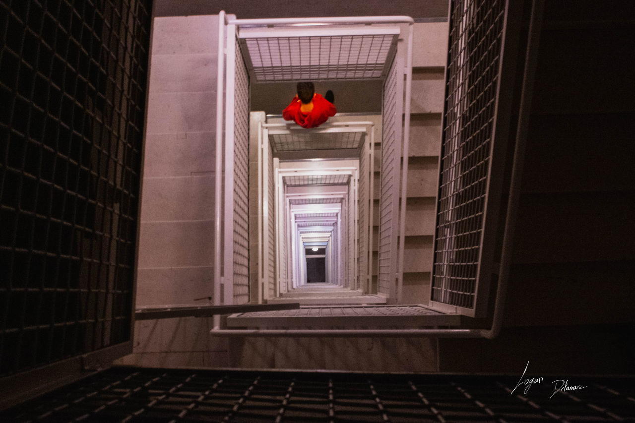 RED DOOR OF BUILDING WITH STAIRCASE