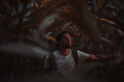 Portrait of young man in field