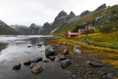 Panoramic view of remote fishing village at the coast and mountains in moskenesoya lofoten in norway