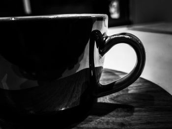 Close-up of coffee cup on table