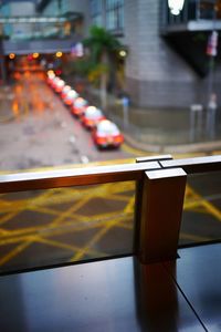Illuminated car on street in city