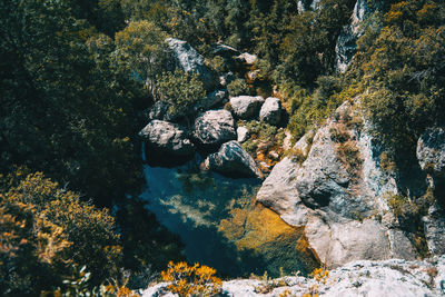 High angle view of rocks by sea