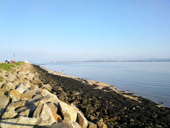 Scenic view of sea against clear blue sky