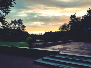 Scenic view of trees against sky during sunset