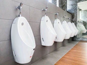 White umbrellas hanging on wall in bathroom