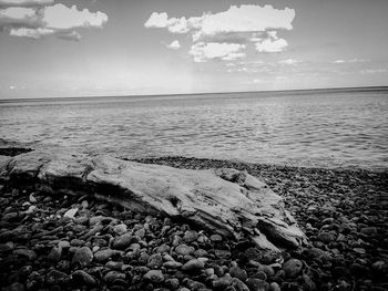 View of calm beach against the sky