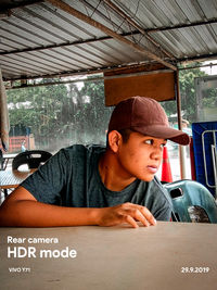 Portrait of young man sitting in car