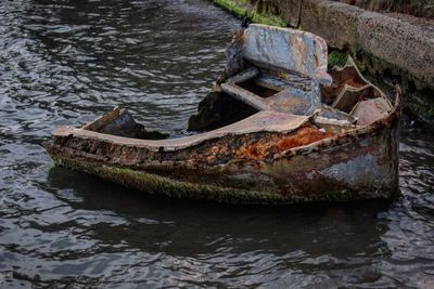 Abandoned boat in river