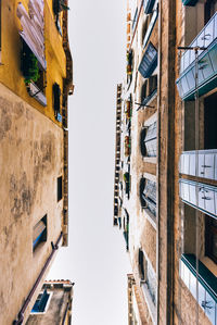 Low angle view of buildings against clear sky