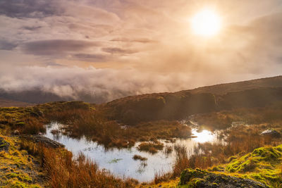 Scenic view of mountains against sky during sunset