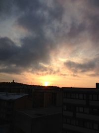 Silhouette of built structure at sunset