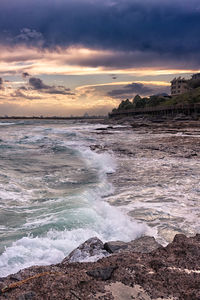 Scenic view of sea against cloudy sky