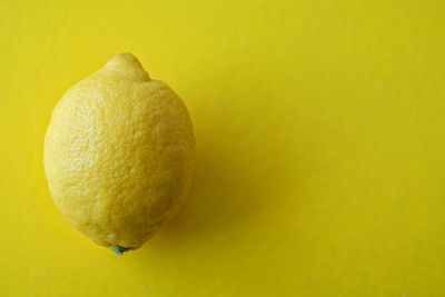 Close-up of bananas over yellow background