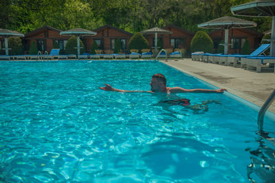 Man swimming in pool