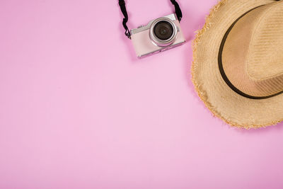 High angle view of hat on pink background