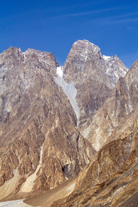 Scenic view of snowcapped mountains against clear sky