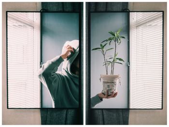 Woman standing by window