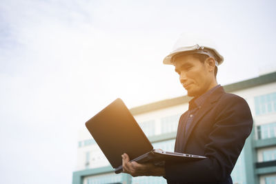 Businessman holding computer notebook work