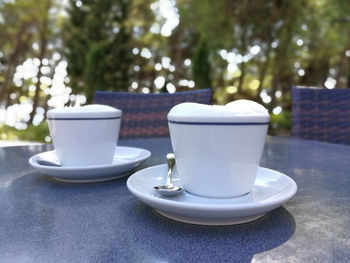 Close-up of coffee cup on table