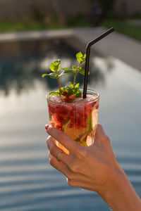 Close-up of woman hand holding drink