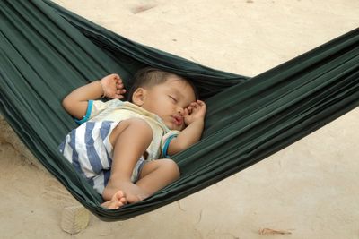 Cute baby girl lying on floor