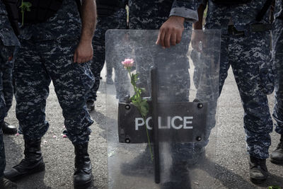 Low section of police force standing on street