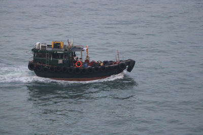 High angle view of ship sailing on sea