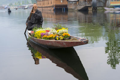 Man on boat at lake