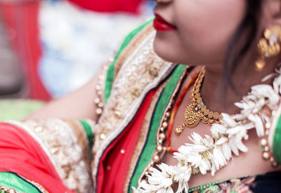 Close-up of woman holding flowers