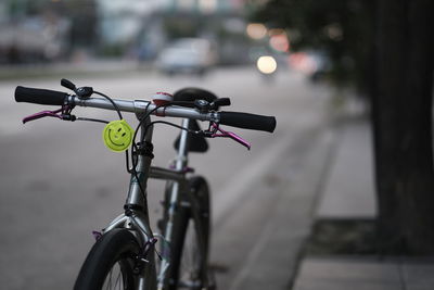 Close-up of bicycle parked on street