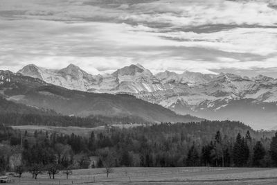 Scenic view of snowcapped mountains against sky